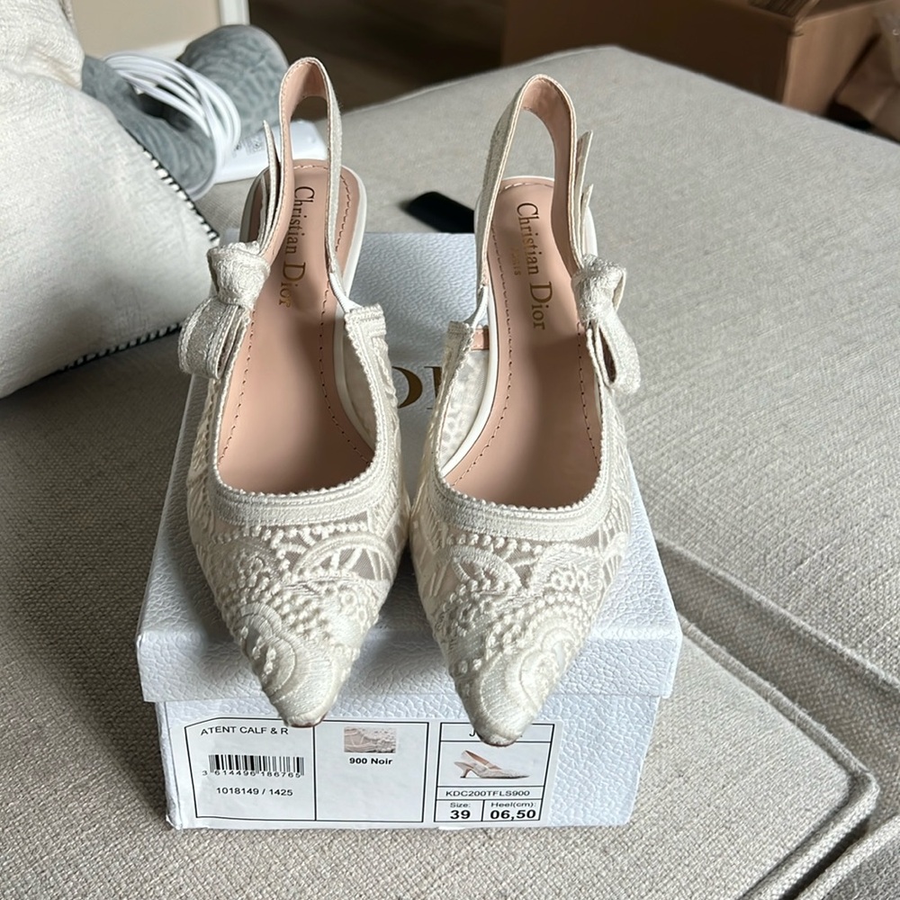 White lace slingback pumps